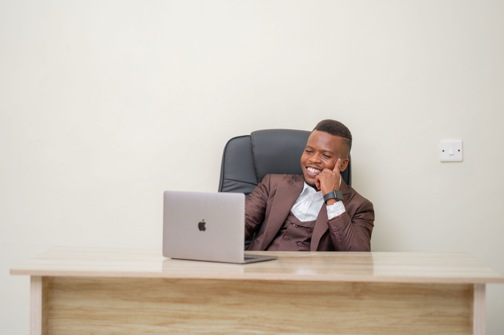 Tikumbuke Humphrey Harare, founder of LWT, working at his desk